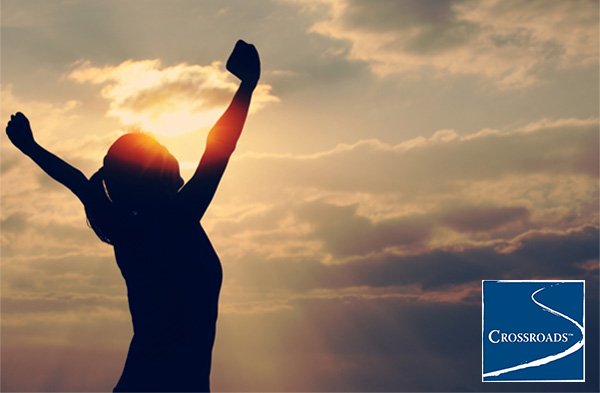 Pregnancy-and-Addiction-Overcoming-Fear-and-Finding-Healing woman with hands in the air celebrating Overcoming fear and finding healing