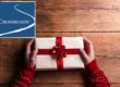 man holding christmas present for a loved one in recovery