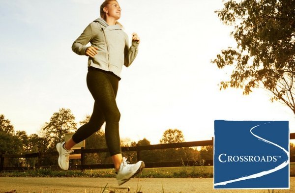 woman creating a heart-healthy lifestyle by running in the park