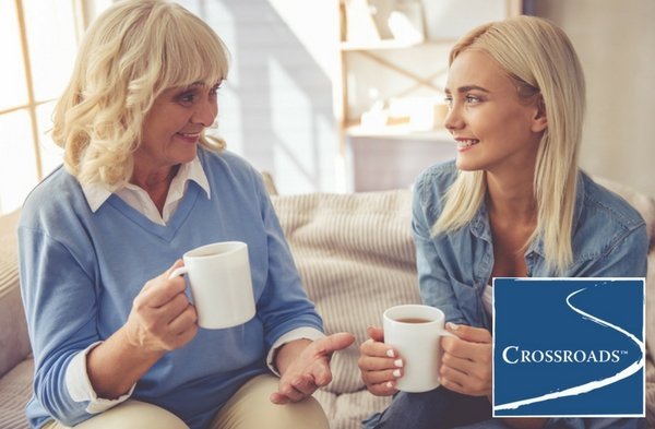 mother drinking coffee with daughter and creating healthy boundaries for their loved one struggling with addiction