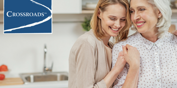 Reducing Risk of Addiction Family History.CRBlog2 mother and adult daughter in the kitchen working together to reduce risk of addiction family history