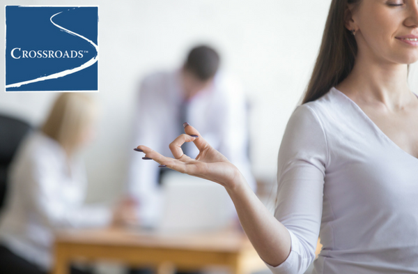 woman reducing stress without the need for drugs or alcohol at work