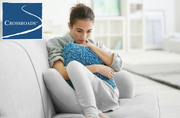 depressed woman on couch ready for treatment for depression and addiction