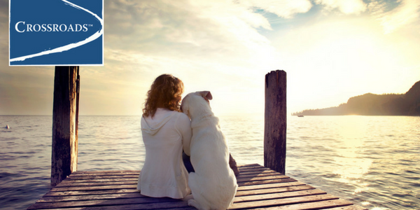 Finding Gratitude in Addiction Recovery.CRBlog3 woman with dog on dock showing Gratitude in Addiction Recovery at Crossroads