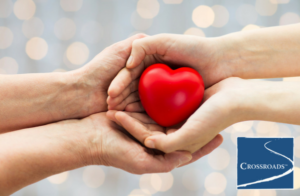 hands holding heart to show the impact of drugs and heart health