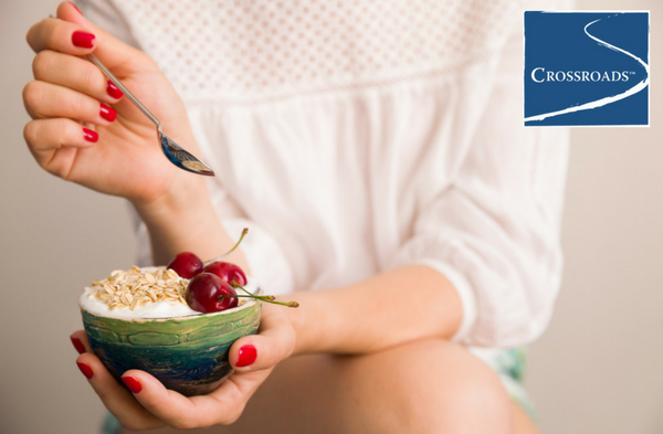 Building a Healthier Diet to Support Addiction Recovery.CRBlog2 woman eating healthier diet for addiction recovery