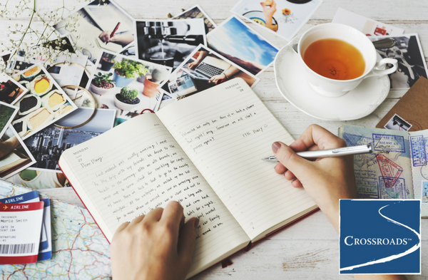 woman drinking tea and journaling to support addiction recovery
