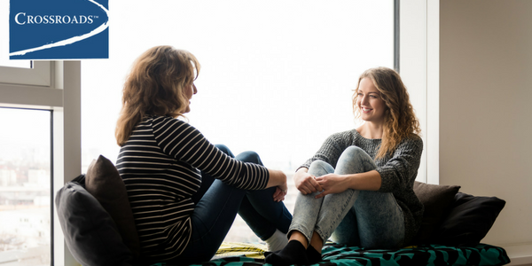 Start the Conversation_ Talking to Your Kids About Drinking.CRBlog2 mother and daughter sitting by the window discussing the two new therapy groups at Crossroads