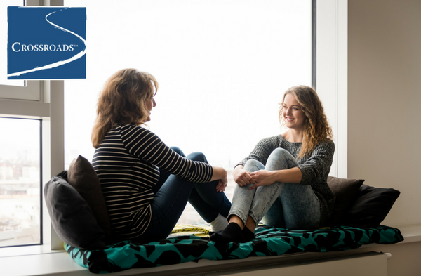 Start the Conversation_ Talking to Your Kids About Drinking.CRBlog2 mother and daughter sitting by the window discussing the two new therapy groups at Crossroads