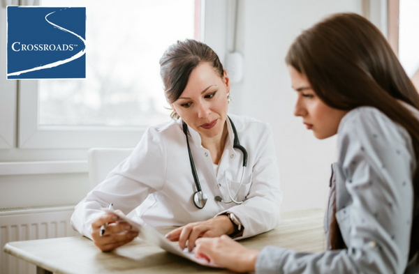 doctor going over managing addiction and anxiety techniques together