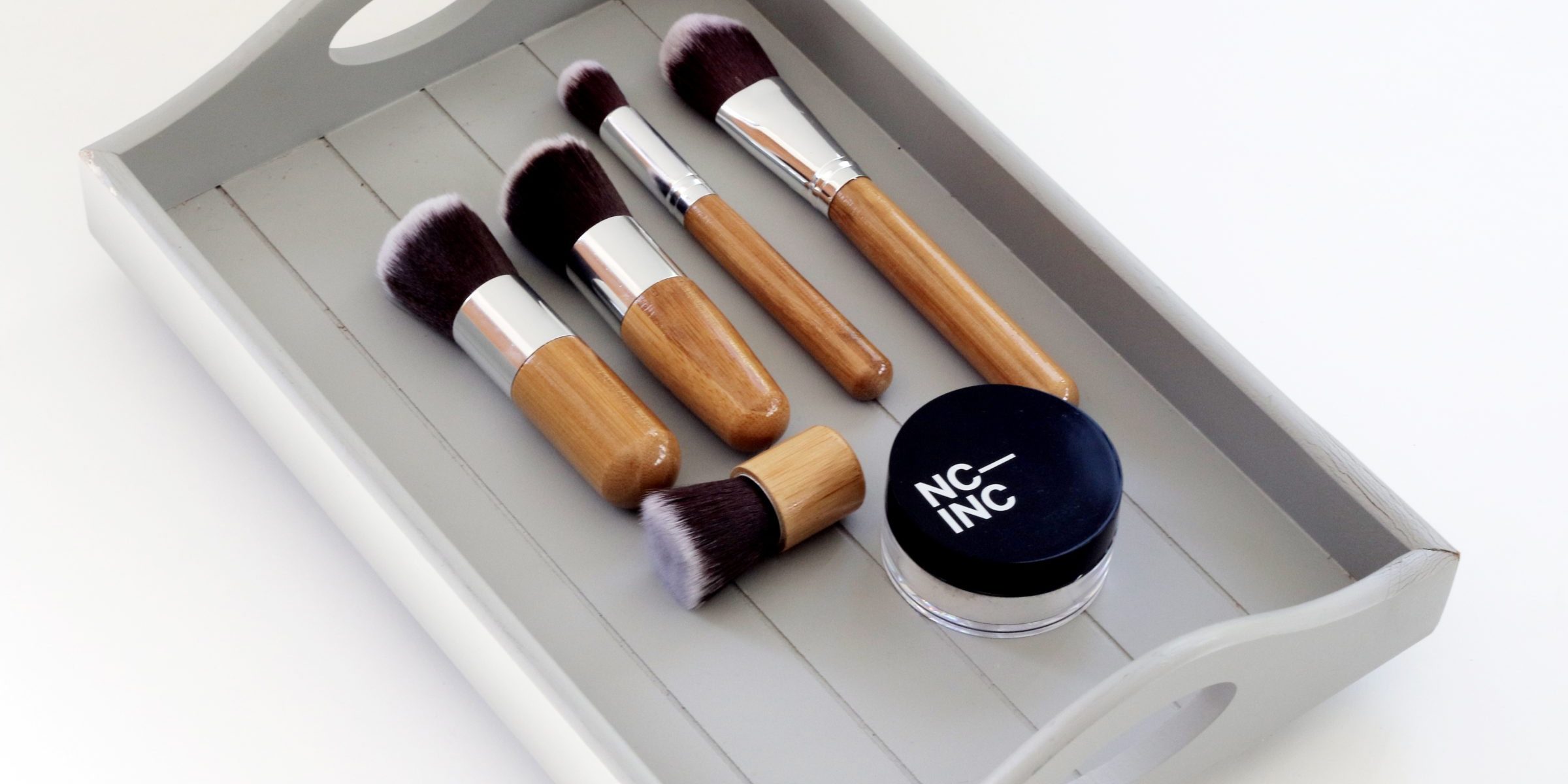 Photo by Oli Dale makeup in a wood tray