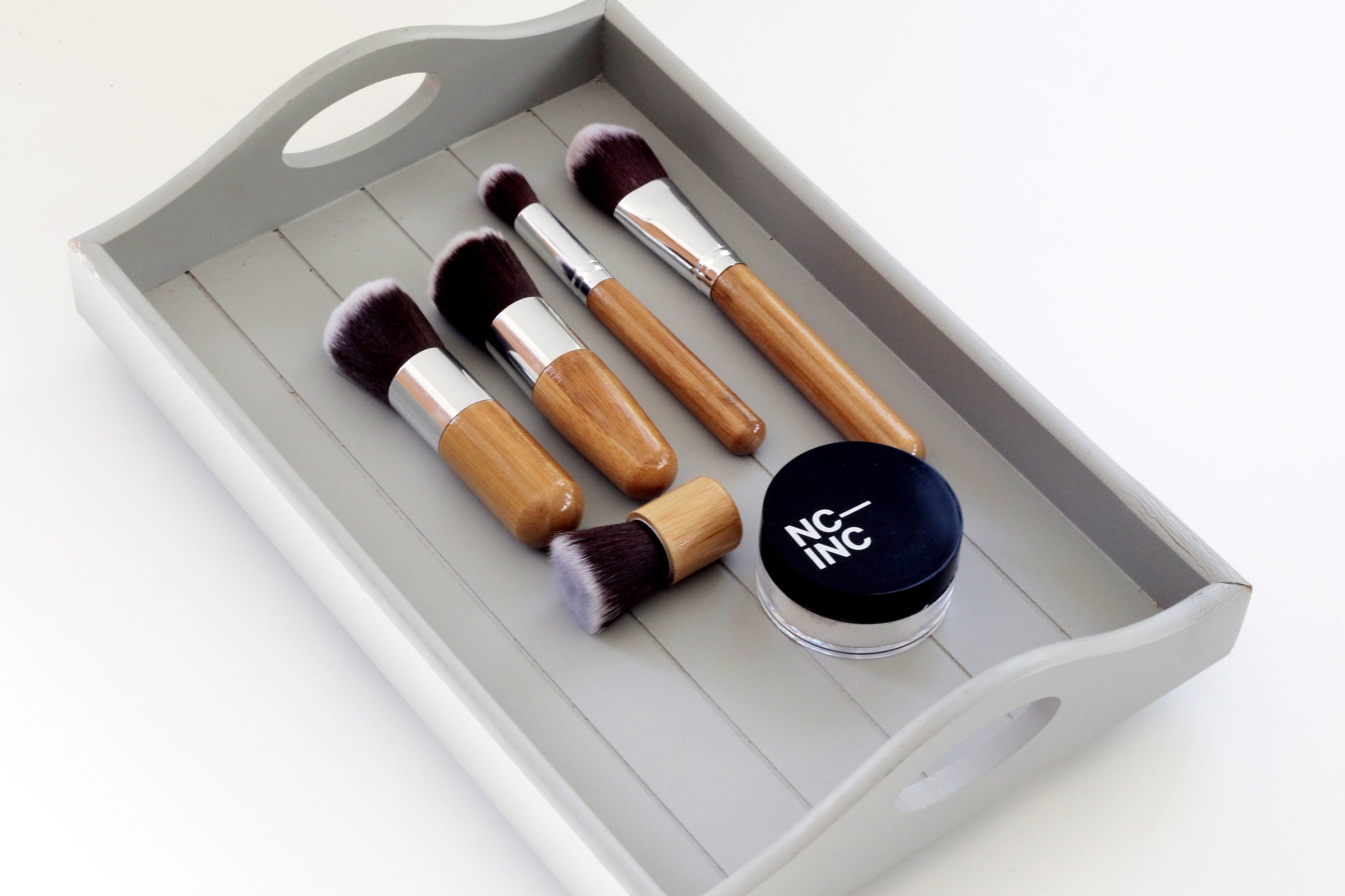 makeup in a wood tray