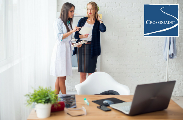 therapist giving woman a list of activities to reduce boredom and increase motivation
