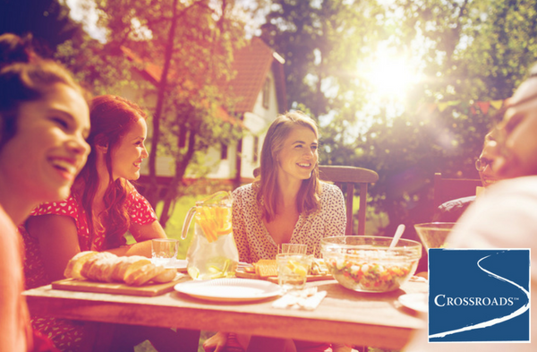 women sharing meal outside to socialize during their women's recovery program