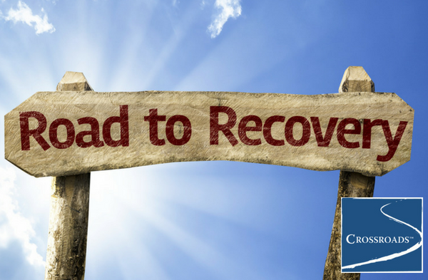 road to recovery sign for overcoming addiction