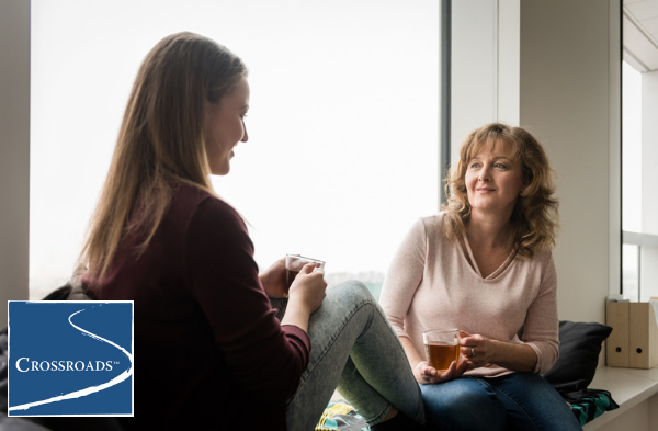 mother and daughter drinking tea and talking about building an addiction recovery support system