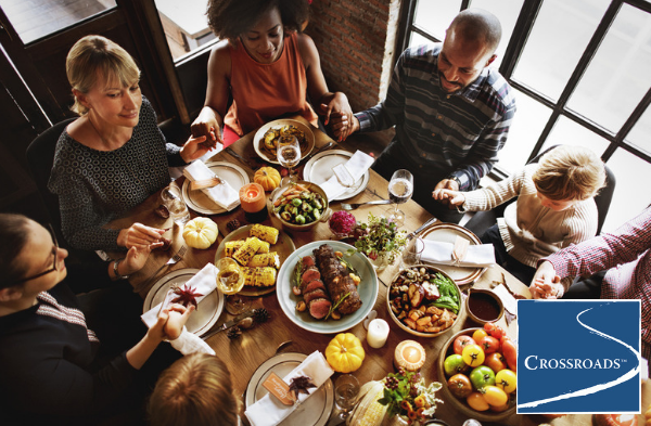 family blessing and support system over holiday meal