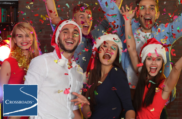 smiling family members at holiday party becoming a stressor in recovery