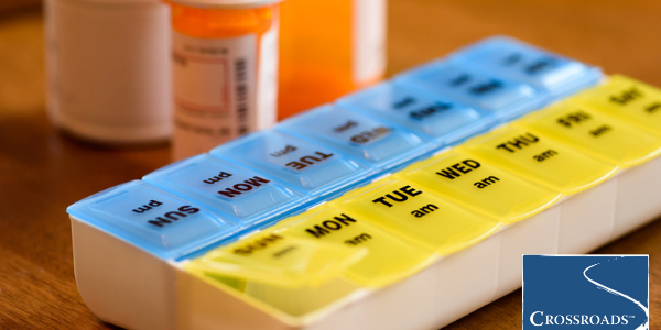 weekly pill box showing missing days from drinking problem