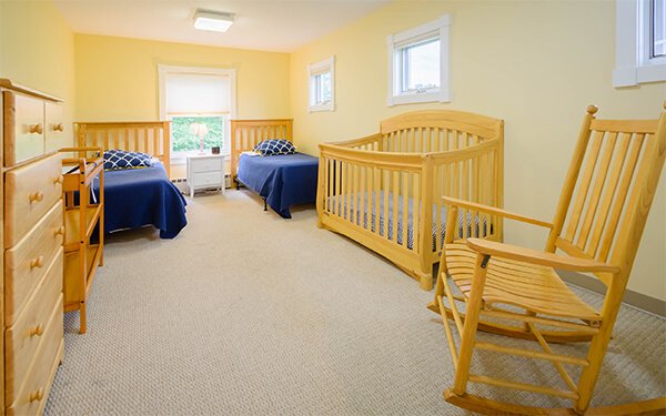 Crossroads-Windham-6-edited bedroom with cribs at rehab for women with children house