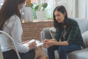 woman in one-on-one therapy at opioid addiction treatment center