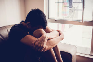 man showing signs of PTSD that could benefit from Crossroads' PTSD treatment program