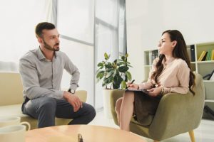man talking to therapist about Crossroads' meth addiction treatment center