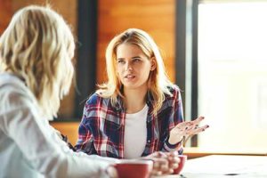 women having a conversation at a drug addiction treatment center
