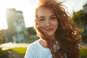 smiling woman knowing why gender-responsive treatment at Crossroads is successful