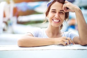 woman smiling after hearing our mission at Crossroads Maine