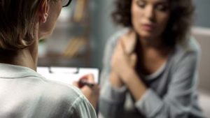 woman speaking with a therapist through a Trauma Therapy Program in Portland Maine