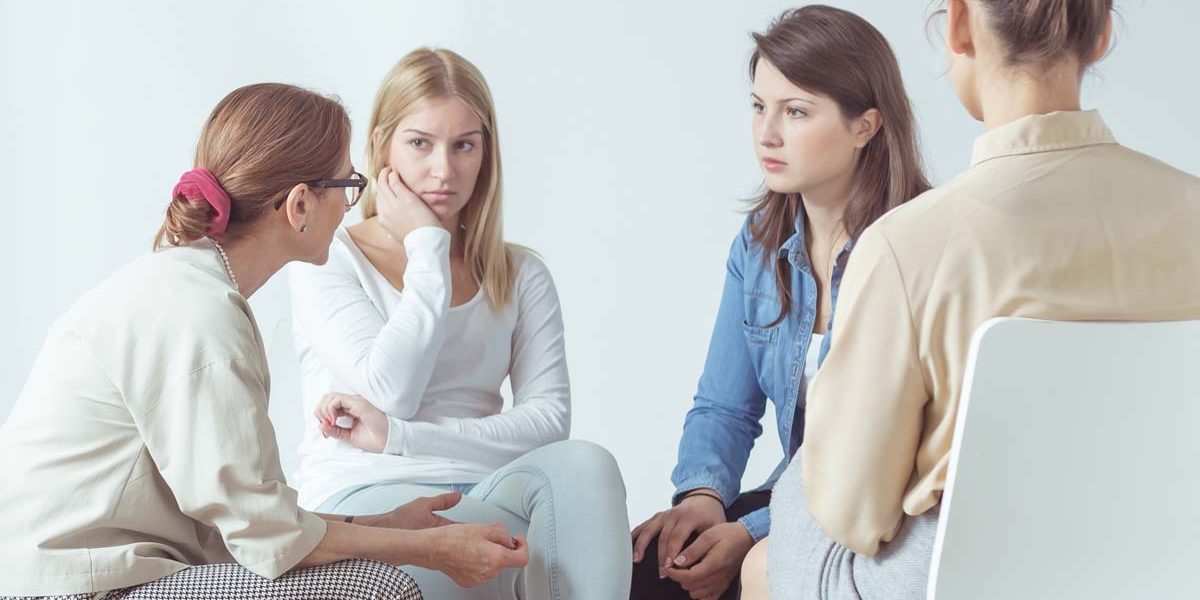importance-of-gender-specific-treatment a group of women discuss the importance of women's addiction treatment