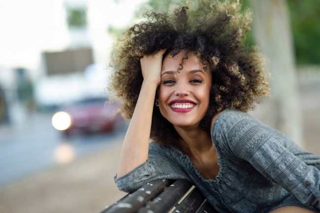 happy woman smiling celebrating national recovery month