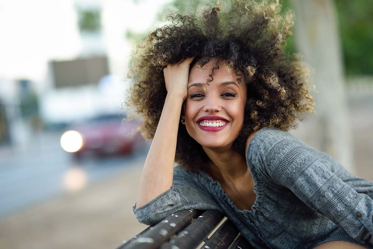 national recovery month happy woman smiling celebrating national recovery month