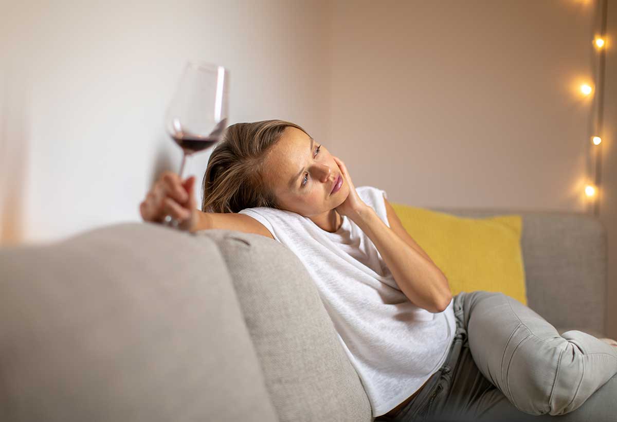 alcohol-addiction woman struggling with alcohol addiction due to life events