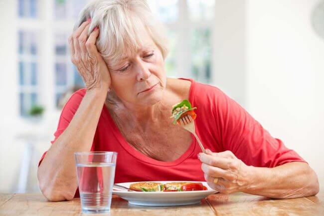 a woman struggles with eating disorder relapse signs