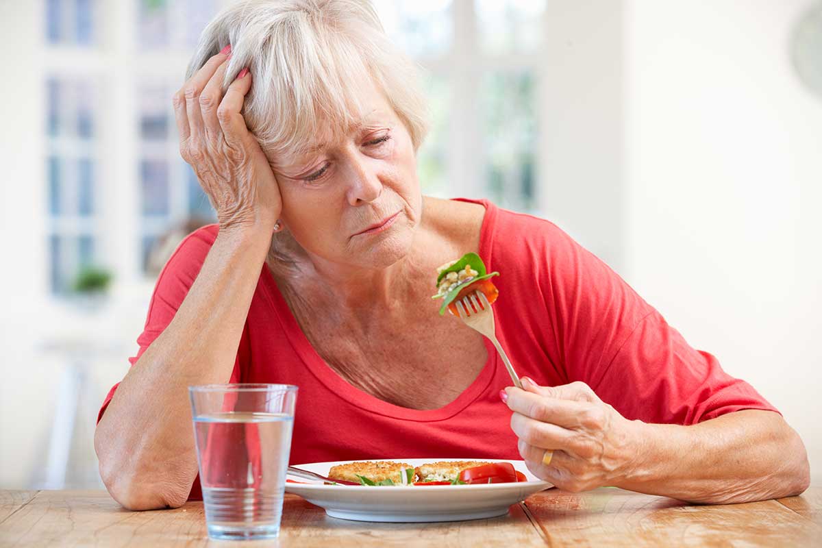 a woman struggles with eating disorder relapse signs