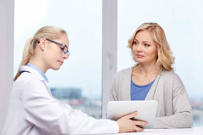 2-What-to-Expect-During-Alcohol-Addiction-Treatment a woman enrolls in an alcohol addiction treatment center