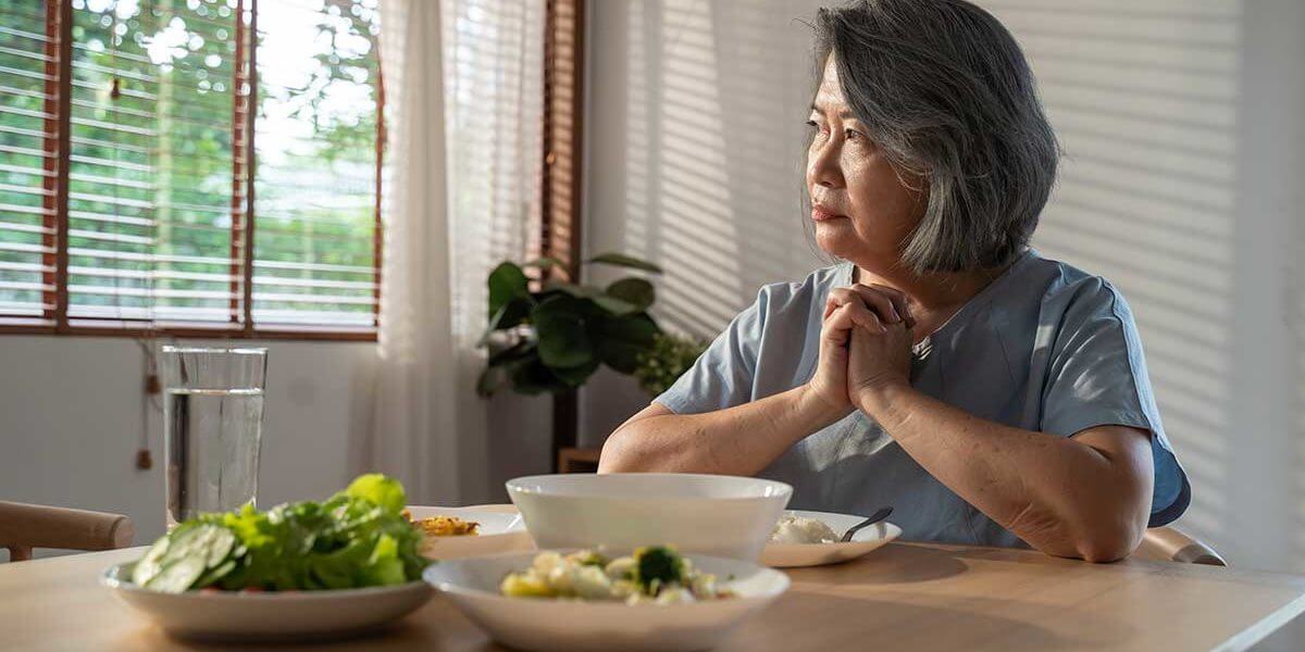 3-When-to-Seek-Eating-Disorder-Treatment a woman wonders if she should seek eating disorder treatment in maine