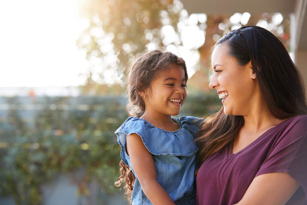 a woman is happy she sought rehab for mother and child