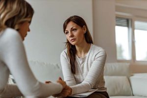 a woman receives help for adderall addiction treatment