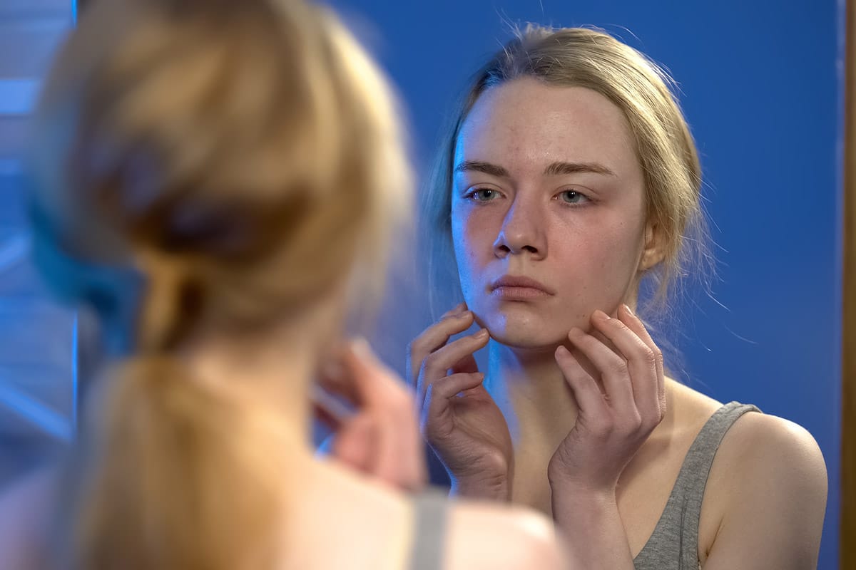 a woman looks for support on national eating disorders awareness week