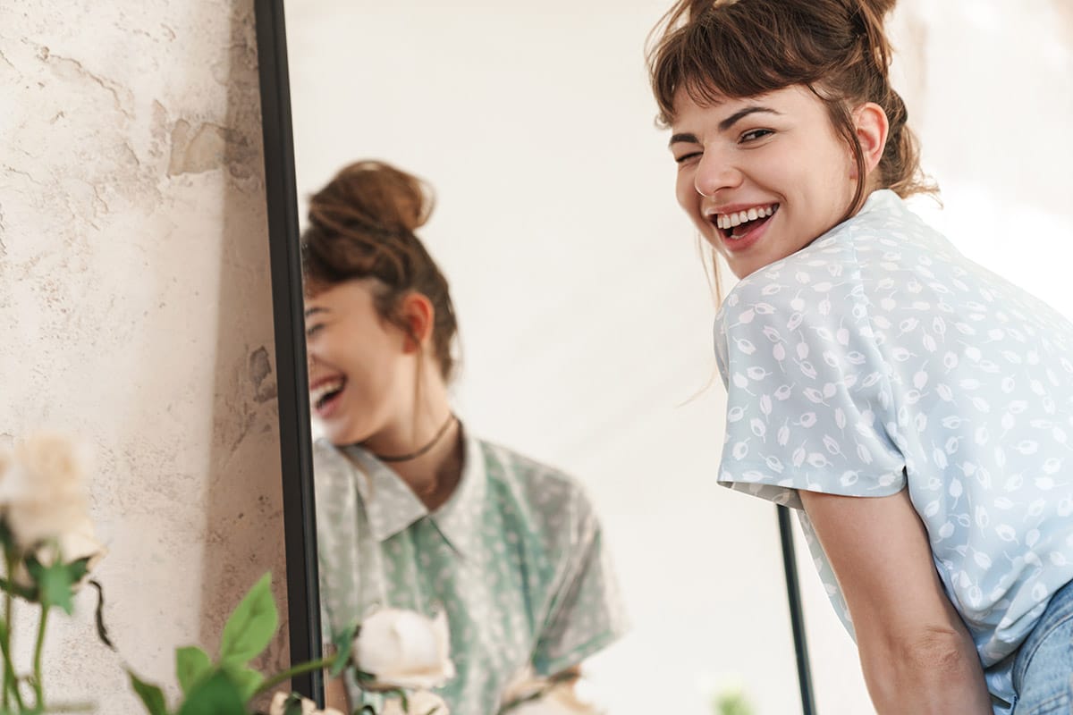 Continuing Your Eating Disorder Recovery in IOP a woman celebrates eating disorder recovery