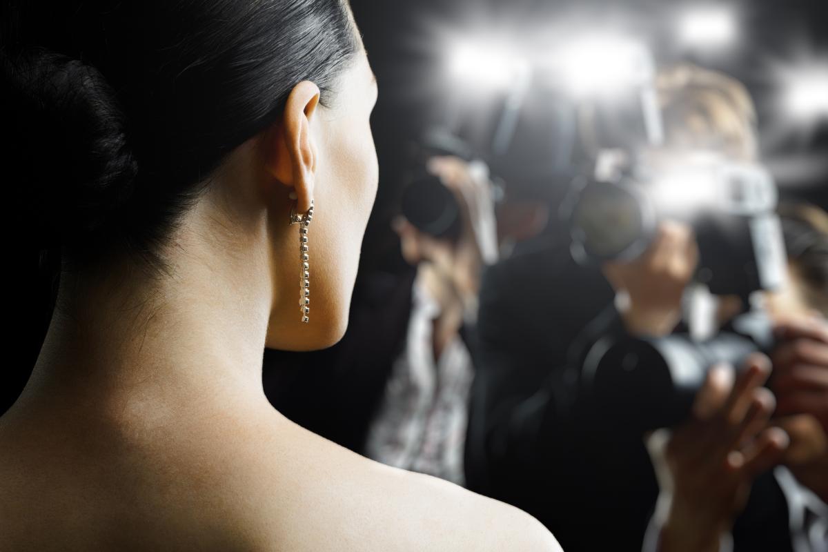 3 Celebrities Who Got Help For Addiction an actress in flashing camera lights considers a celebrity with drug addiction and celebrity rehab