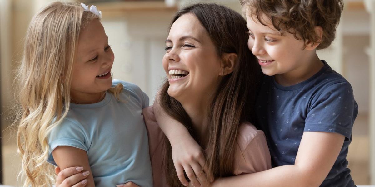 Finding the Right Rehab for Women With Children a woman plays with her children after attending a rehab for women with children