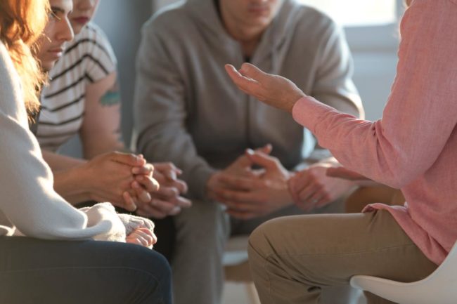 people in a group discussing the benefits of iop