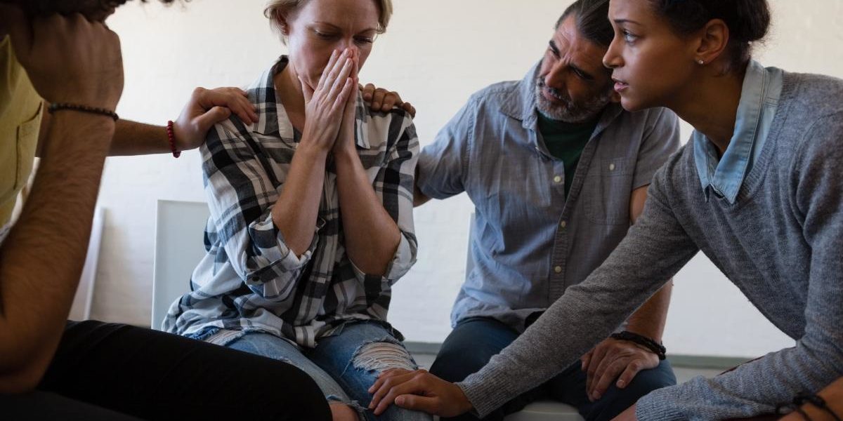 a group of people comfort a young woman with alcohol addiction quotes