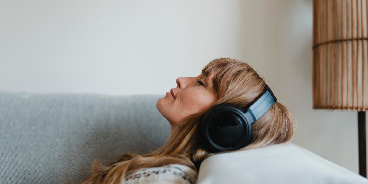 women listening to music in recovery